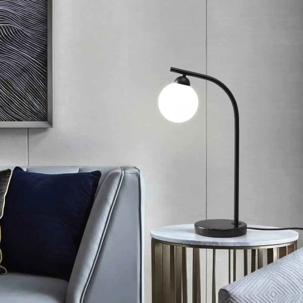 bohemian table lamps with colorful patterns for eclectic bedroomsbohemian table lamps with colorful patterns for eclectic bedroomsAlbaldah - Ivory Glass Ball Shade Table Light with Black/Gold Bended Stand